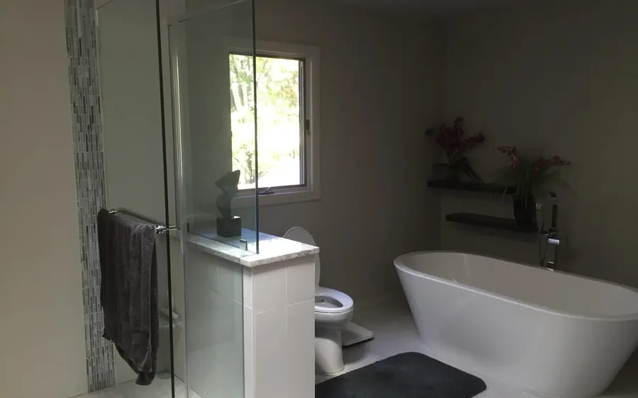 Primary bathroom remodel with a glass walk-in shower and freestanding tub in Monmouth County, NJ