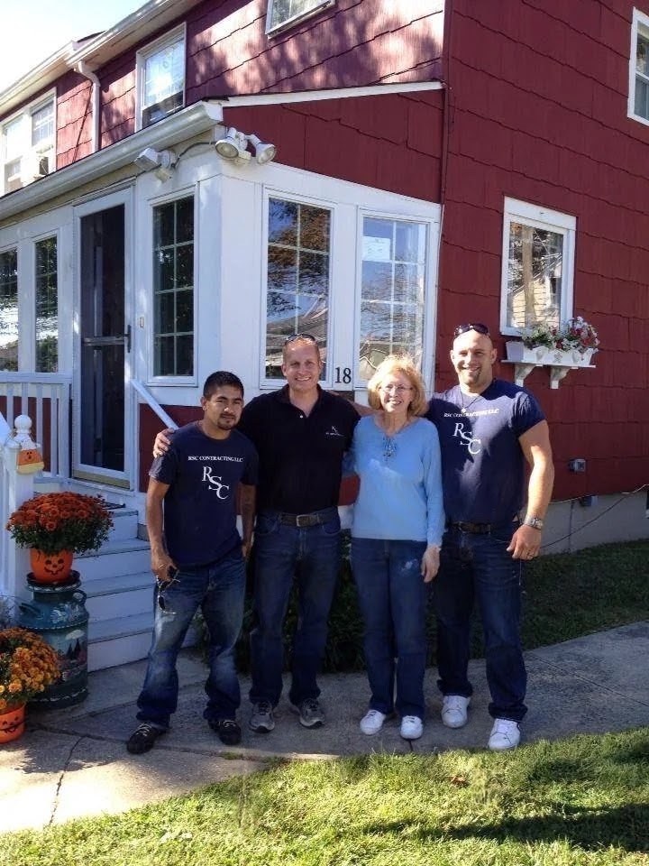 Rob and the RSC Contracting crew with a longtime client outside her Monmouth County home